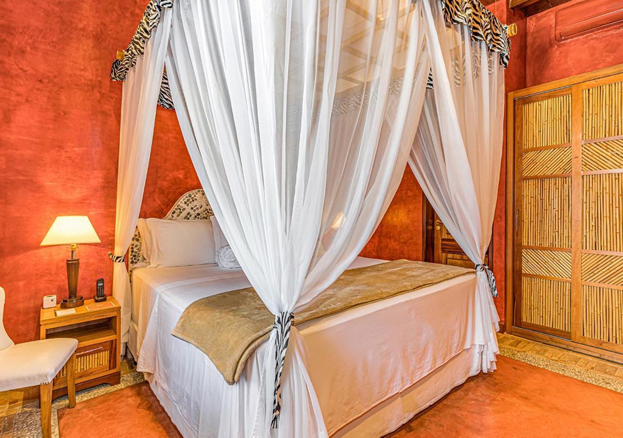 Dpny Beach Hotel & Spa Ilhabela Exterior foto A bed with a mosquito net