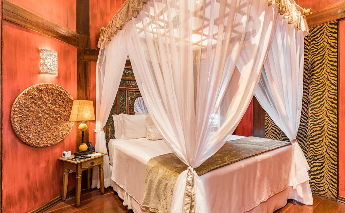 Dpny Beach Hotel & Spa Ilhabela Exterior foto A mosquito net over a bed